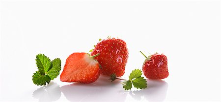 Two whole strawberries and one half Stock Photo - Premium Royalty-Free, Code: 659-01854904