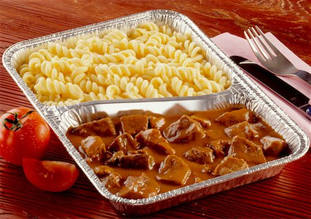 Beef goulash and pasta in aluminium dish Stock Photo - Premium Royalty-Free, Code: 659-01854920