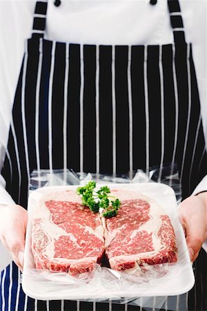 steak chunk - Two beef steaks with parsley Stock Photo - Premium Royalty-Free, Code: 659-01854970