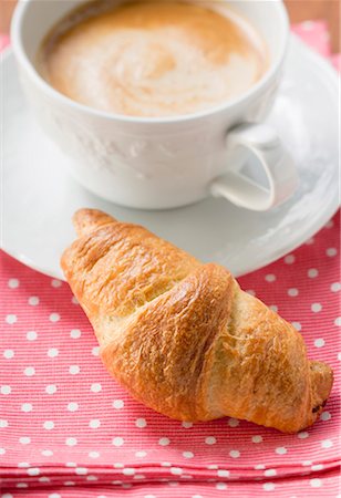 puff pastry - A croissant with a cup of cappuccino Stock Photo - Premium Royalty-Free, Code: 659-01854997
