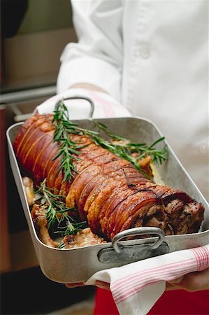 Boned and rolled saddle of suckling pig in a roasting dish Stock Photo - Premium Royalty-Free, Code: 659-01855013