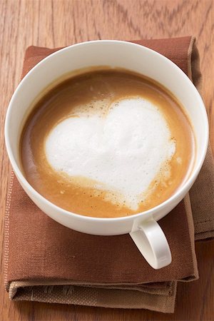 simsearch:659-03536885,k - A cup of cappuccino with heart- shaped milk froth Stock Photo - Premium Royalty-Free, Code: 659-01855102