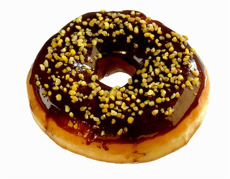 Doughnut with chocolate icing and pistachios Stock Photo - Premium Royalty-Free, Code: 659-01855117