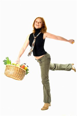 people with fruits cutout - Young woman holding shopping basket full of fresh food Stock Photo - Premium Royalty-Free, Code: 659-01855147