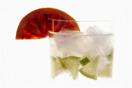 simsearch:659-02211415,k - Mineral water with lime wedges, ice cubes and blood orange Stock Photo - Premium Royalty-Free, Code: 659-01855167