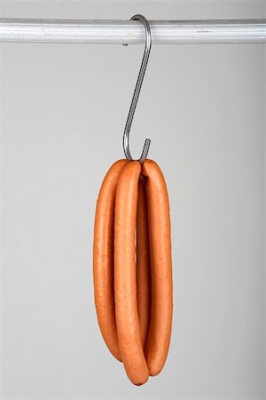 simsearch:659-01852769,k - Two pairs of frankfurters on a hook Foto de stock - Royalty Free Premium, Número: 659-01855195
