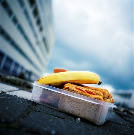 Lunch box containing cold cut sandwiches and banana Stock Photo - Premium Royalty-Free, Code: 659-01855284