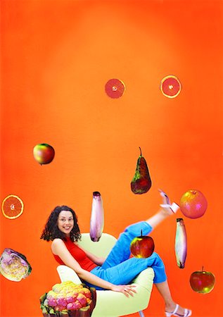 simsearch:659-01855145,k - Woman sitting in chair surrounded by flying fruit & vegetables Foto de stock - Royalty Free Premium, Número: 659-01855280