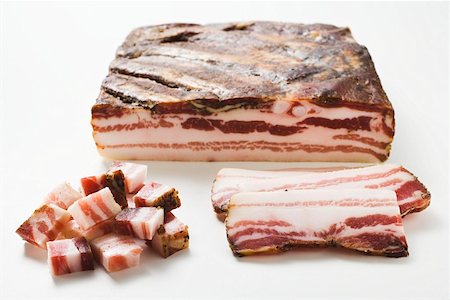 Smoked belly bacon, a piece, slices and diced Stock Photo - Premium Royalty-Free, Code: 659-01855338