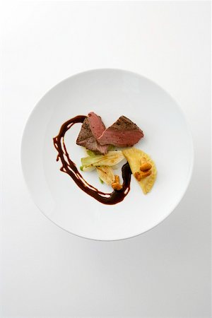 simsearch:659-01850954,k - Roasted venison medallion with fennel and ravioli Stock Photo - Premium Royalty-Free, Code: 659-01855350