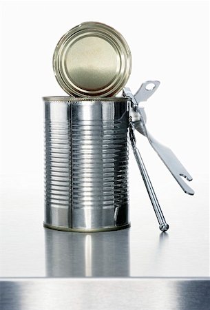 A food tin with a tin opener Stock Photo - Premium Royalty-Free, Code: 659-01855402