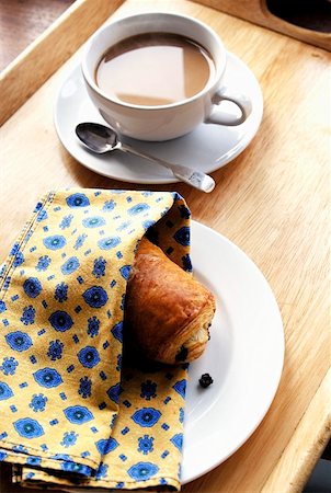 pain au chocolat - A cup of coffee with a chocolate croissant on a tray Stock Photo - Premium Royalty-Free, Code: 659-01855415