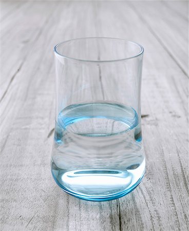 Glass of water on wooden background Stock Photo - Premium Royalty-Free, Code: 659-01855606