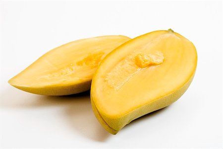 A halved Thai mango Stock Photo - Premium Royalty-Free, Code: 659-01855800