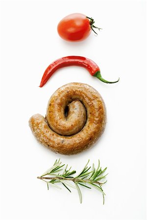 rosemary sprig - A coiled sausage with rosemary, chilli and tomato Stock Photo - Premium Royalty-Free, Code: 659-01855889