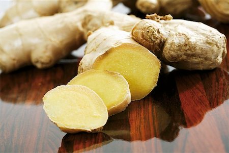 fresh ginger - A ginger root, partly sliced Stock Photo - Premium Royalty-Free, Code: 659-01855956