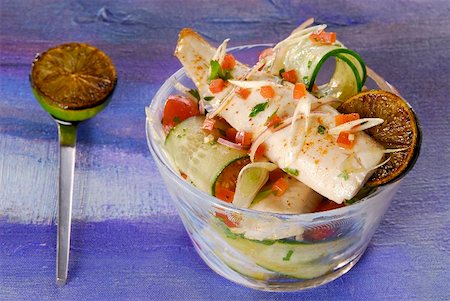 Fried trout fillet on tomato and cucumber salad Stock Photo - Premium Royalty-Free, Code: 659-01856065