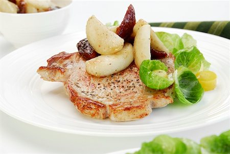 pork chops not raw - Pork chop with potatoes and dates Stock Photo - Premium Royalty-Free, Code: 659-01856181