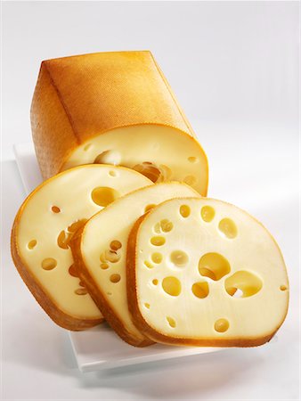 Smoked cheese, partly sliced Stock Photo - Premium Royalty-Free, Code: 659-01856296