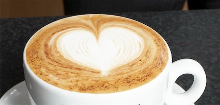 A cup of cappuccino with milk foam decorated with heart Stock Photo - Premium Royalty-Free, Code: 659-01856506