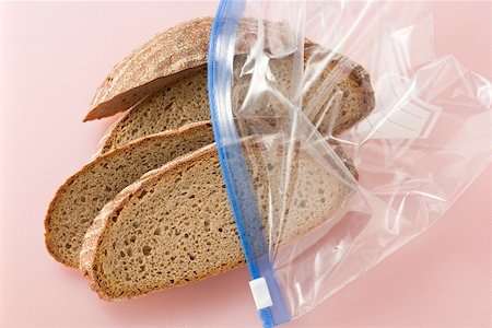 Four slices of mixed wheat and rye bread in a plastic bag Stock Photo - Premium Royalty-Free, Code: 659-01856659