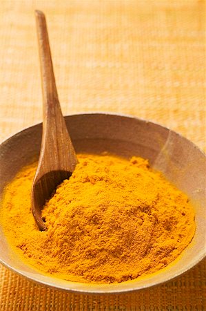 Turmeric in bowl with spoon Stock Photo - Premium Royalty-Free, Code: 659-01856799