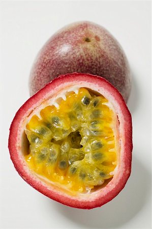 red passion fruit - Purple granadilla (passion fruit) halved Stock Photo - Premium Royalty-Free, Code: 659-01856875