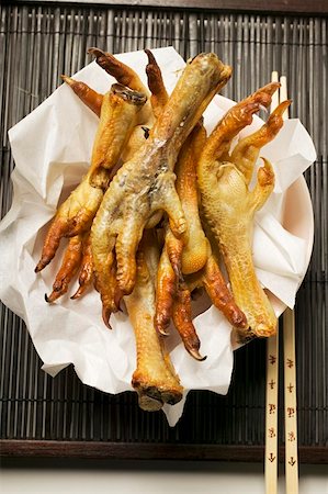 simsearch:659-01857015,k - Deep-fried chicken feet on paper (Asia) Stock Photo - Premium Royalty-Free, Code: 659-01856994