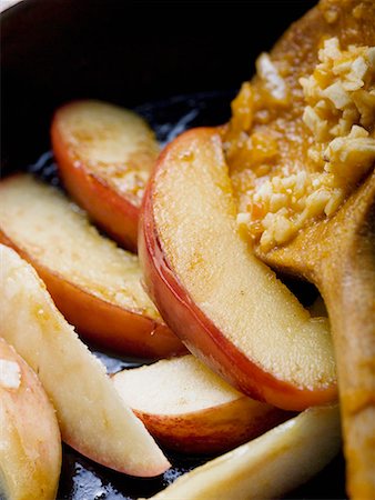 pan fried - Fried apple wedges in frying pan Stock Photo - Premium Royalty-Free, Code: 659-01857059