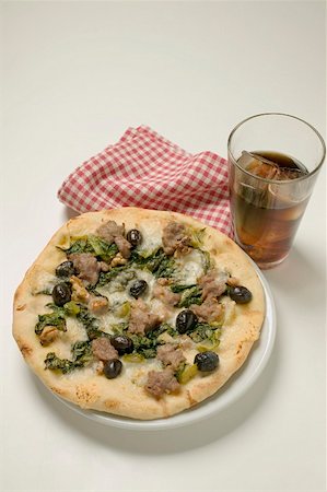 silver beet - Pizza with tuna, chard and olives glass of cola Stock Photo - Premium Royalty-Free, Code: 659-01857304