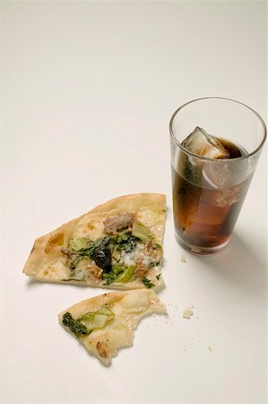 swiss chard - Slice of pizza with tuna, chard and olives, glass of cola Stock Photo - Premium Royalty-Free, Code: 659-01857306