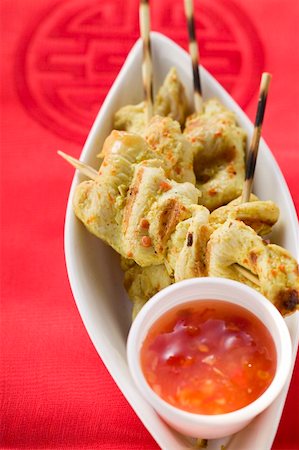 south east asian cooking - Spicy satay with sweet and sour chili sauce (Indonesia) Stock Photo - Premium Royalty-Free, Code: 659-01857321