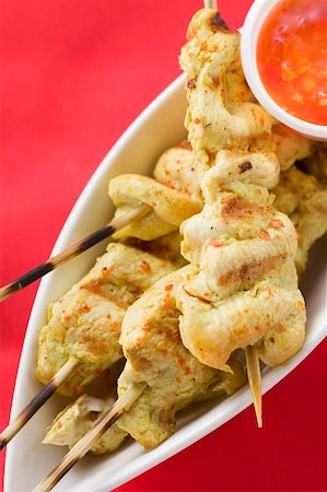 poultry skewer - Spicy satay with sweet and sour chili sauce (Indonesia) Stock Photo - Premium Royalty-Free, Code: 659-01857322