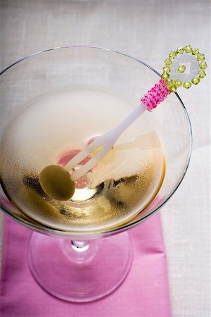 simsearch:659-03529606,k - Martini with green olive on cocktail fork Stock Photo - Premium Royalty-Free, Code: 659-01857410