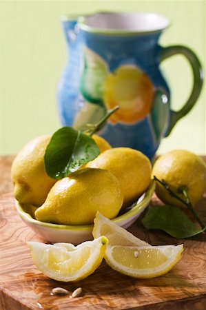 simsearch:659-01857464,k - Lemon wedges and lemons with leaves Stock Photo - Premium Royalty-Free, Code: 659-01857804