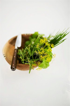 simsearch:659-01858065,k - Assorted herbs in wooden bowl with knife Stock Photo - Premium Royalty-Free, Code: 659-01858077