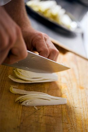 picado de verduras - Slicing chicory Foto de stock - Sin royalties Premium, Código: 659-01858173