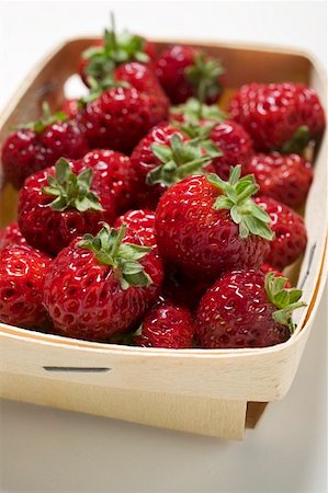 Fresh Strawberries in and Beside a Container Stock Photo - Premium Royalty-Free, Code: 659-01858390