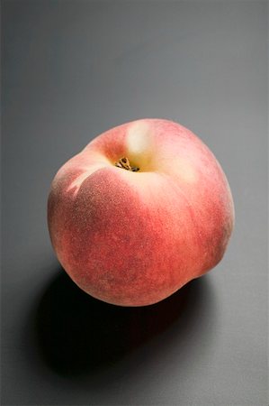 fresh peach - A Single Fuzzy Peach Stock Photo - Premium Royalty-Free, Code: 659-01858436