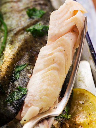 Roast trout with piece on fork (detail) Stock Photo - Premium Royalty-Free, Code: 659-01858636