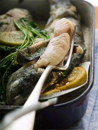 roasted fish - Roast trout with piece on fork (detail) Stock Photo - Premium Royalty-Free, Code: 659-01858637