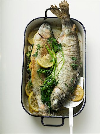 roasted fish - Roast trout in roasting tin Stock Photo - Premium Royalty-Free, Code: 659-01858639