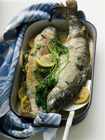 roasted fish - Roast trout in roasting tin Stock Photo - Premium Royalty-Free, Code: 659-01858640