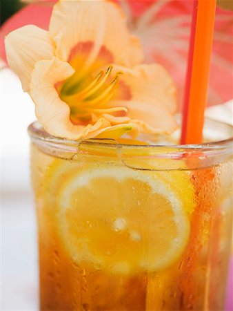 simsearch:659-06306490,k - Tequila Sunrise with lemon and flower Stock Photo - Premium Royalty-Free, Code: 659-01858671