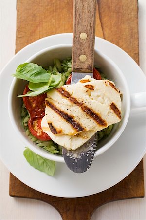 Grilled Haloumi with orzo, basil and tomatoes Stock Photo - Premium Royalty-Free, Code: 659-01858690