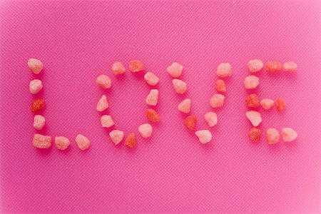 The word 'Love' written in small pink sweets Stock Photo - Premium Royalty-Free, Code: 659-01858742