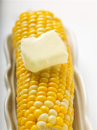 Corn cob with knob of melting butter Stock Photo - Premium Royalty-Free, Code: 659-01858905