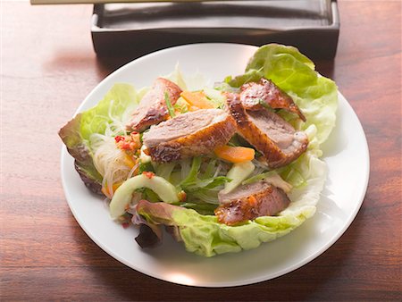 Lettuce with roast duck breast, vegetables, glass noodles (Asia) Stock Photo - Premium Royalty-Free, Code: 659-01858957