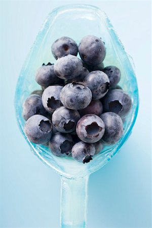 Fresh blueberries in light blue glass jug (overhead view) Stock Photo - Premium Royalty-Free, Code: 659-01859033