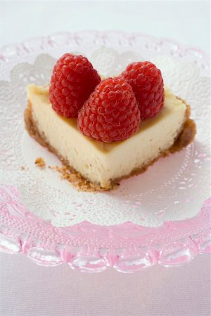 Piece of cheesecake with raspberries Stock Photo - Premium Royalty-Free, Code: 659-01859070